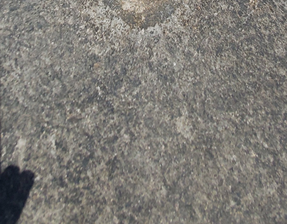 footprint on black rock