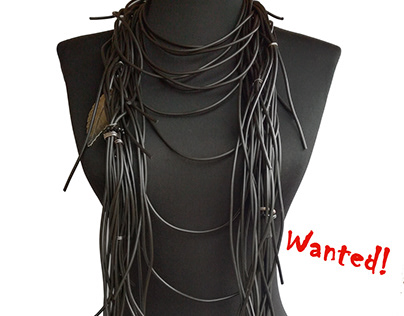 Hand made necklace with black rubber and silver pendant