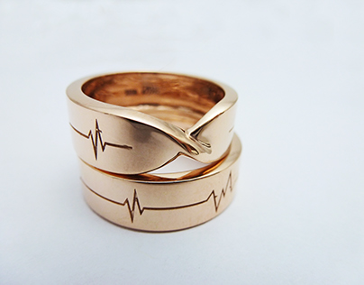 Wedding rings with cardiogram and hidden initials