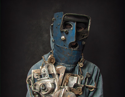 A man wearing a welder's mask