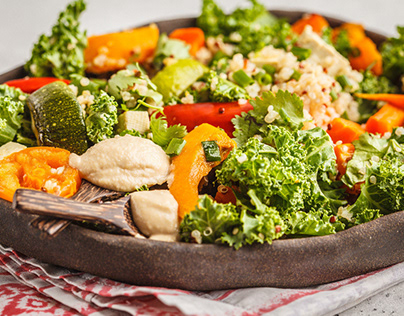 Baked vegetables and kale salad with tahini.