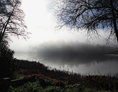 The foggy banks of River Minho in Laias, Galicia, Spain