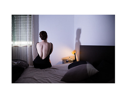 woman in bed and her shadow