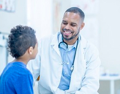 Doctor communicating with young patient