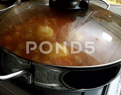 Juicy Meatballs With Potatoes Cooked In A Pot