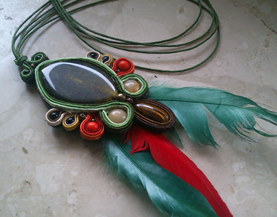 Soutache charm with red and green feathers