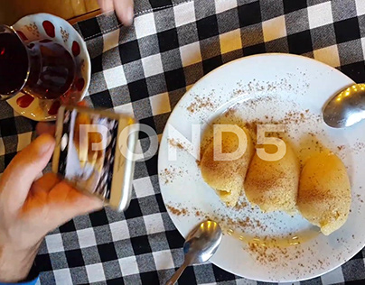 Semolina Halva Tea And Taking Food With Smart Phone