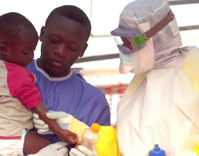 Ebola workers examine a child