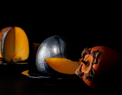 Silver persimmons in front of the mirror, reflections.