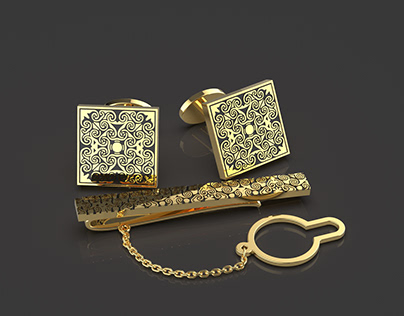 Gold cufflinks and tie clip
