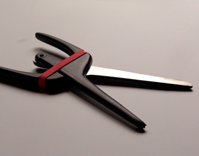 Rubber spring scissors