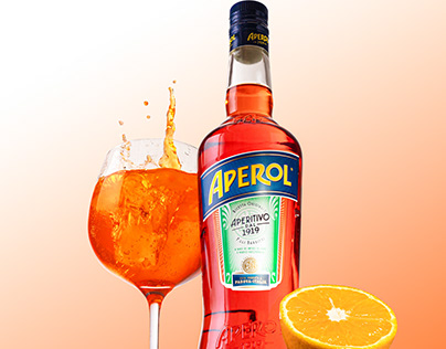 Aperol spritz aperitivo bottle with cocktail and orange
