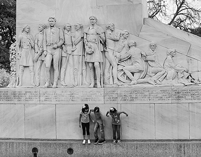 Kids playing on Statue, outside Alamo, San Antonio, TX,