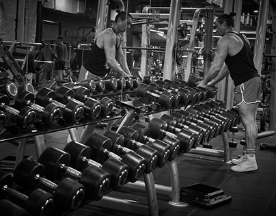 Working out in the gym in black and white