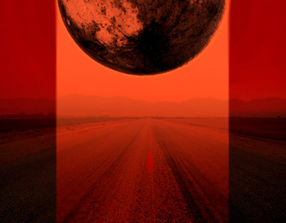 Large red moon hovering over horizon