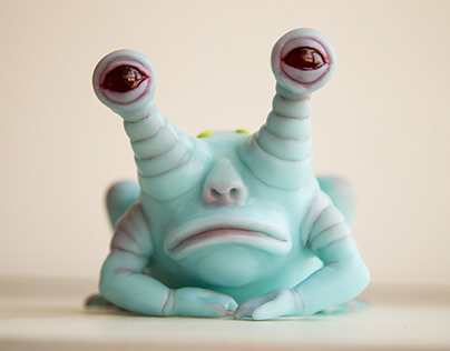 Sculpture of Blue and Sad Frog