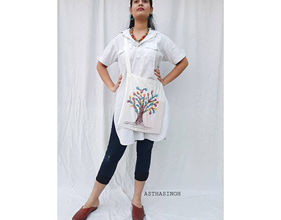 HAND EMBROIDED BAG STYLED WITH KURTA AND BLACK DENIM