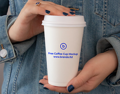 Paper coffee cup in hand free mockup PSD by Brando.ltd