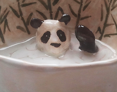 Panda in a bath. A cup