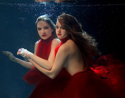 Girls in red underwater