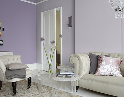 Use purple hues in the living room to convey luxury.