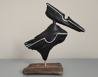 Black driftwood crow