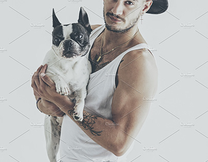 Tattoed boy with french bulldog dog