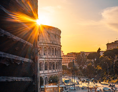 Window view of the Colosseum Rome Italy at sunset