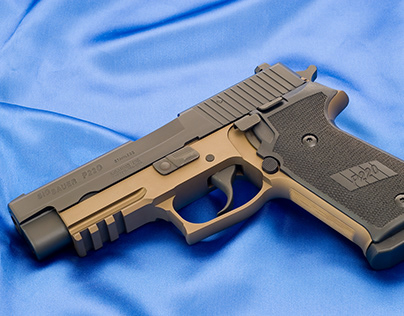 Sig-Sauer P220 Combat with re-checkered black grips