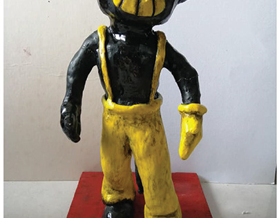 Demon in suspender clothing sculpture