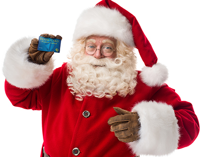 Santa Claus holding a credit card
