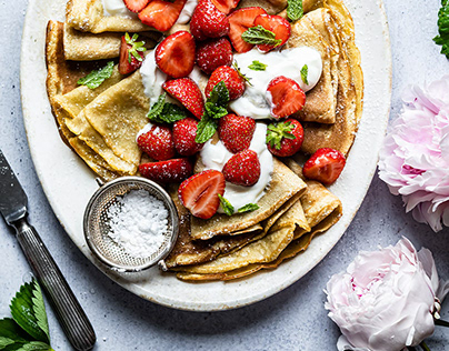 Crepes and greek yoghurt with strawberries