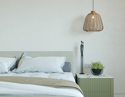Bedroom in neutral colors with olive green accents