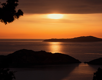 Sunset Over afionas beach corfu greece
