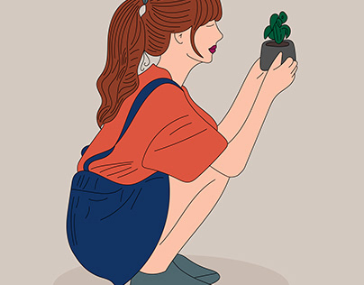 A cute girl is squatting and holding a plant
