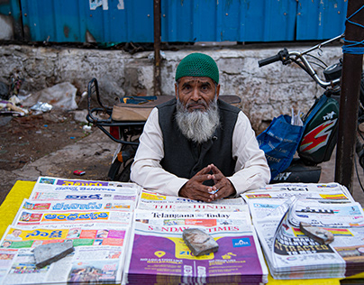 Different language news papers selling
