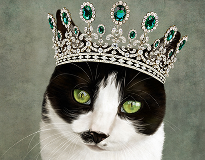 A cat wearing a diamond and emerald crown.