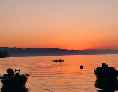 Sunset boats swimming