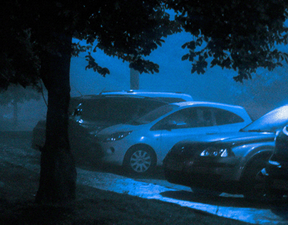 CARS AGAINTS THE BACKGROUND OF FOG