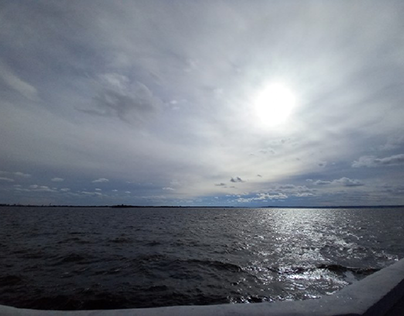 Volga, river, day, sun behind clouds.