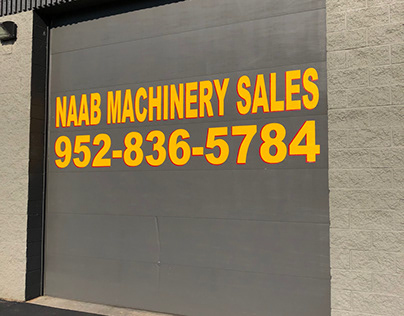 Sign painting on garage doors for local business