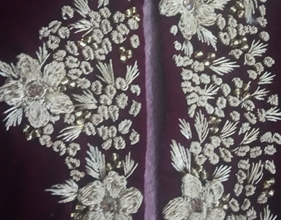 Velvet embroidered wedding wear dress.