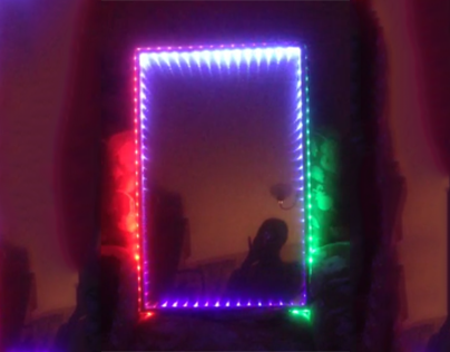 LED mirror with infinity effect and branding.