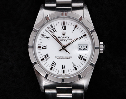 Rolex Oyster Perpetual Date Engine Turned Bezel