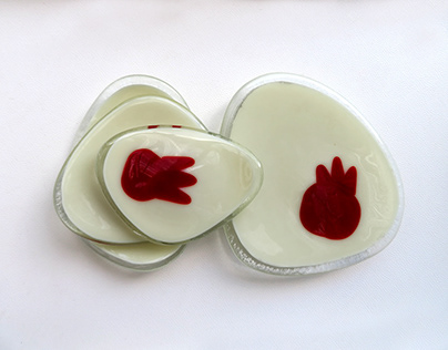 Fused glass trinket dishes with pomegranate decoration
