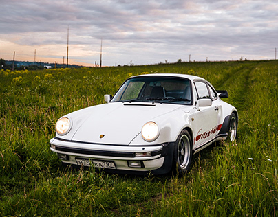 Classic Porsche 911 in contryside fields