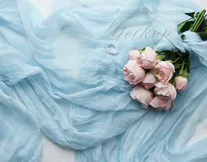 peony roses, pink roses,wedding ring,pale blue chiffon.