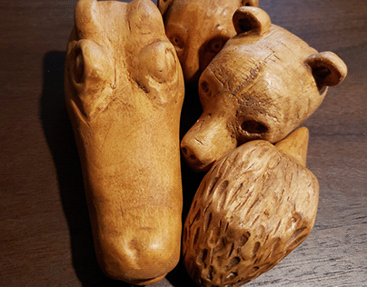 Wood carved animal heads