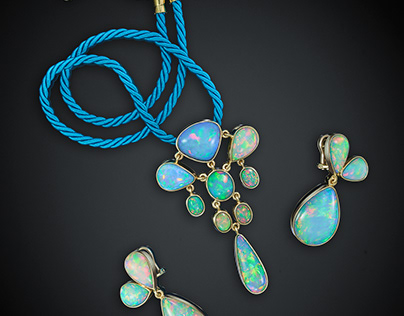 Rainbow jewellery set featuring crystal opals in gold