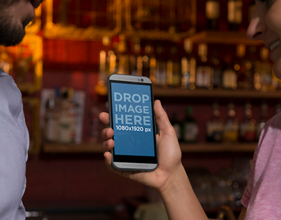 HTC One Mockup Template Featuring a Couple at a Bar